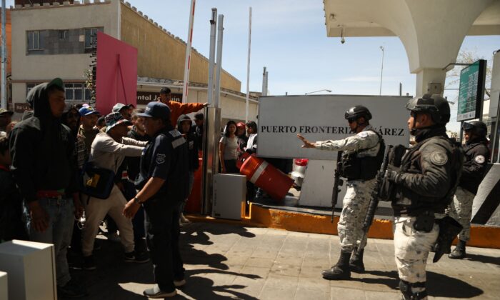 A group of immigrants from the Mexican side of the border attempted to cross the Paso Del Norte International Bridge