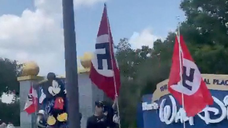 Nazi protesters wave swastika flags outside Disney World